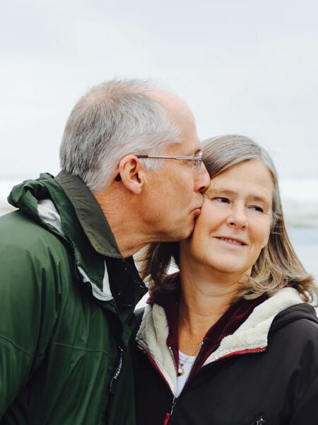 Senior citizens kissing on Long Beach Washington coast